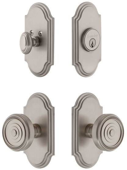 Grandeur Arc Entry Door Set, Keyed Alike with Soleil Knobs in Satin Nickel.